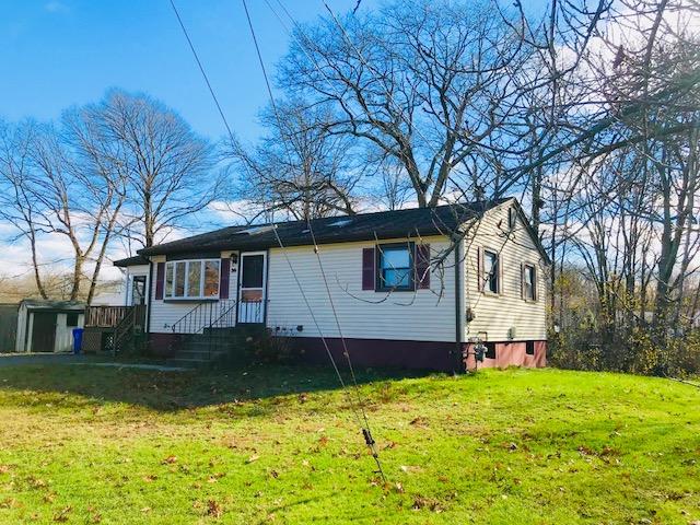 36 Brookside Road Rockland, MA 02370 - Photo 1 of 17 a front view of a house with a yard and garage