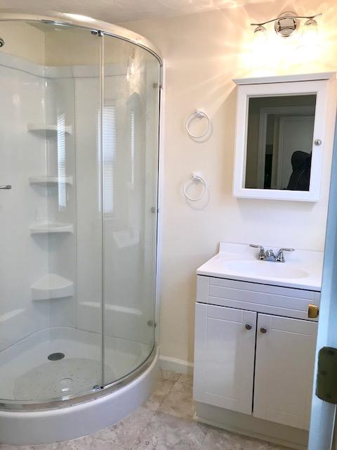36 Brookside Road Rockland, MA 02370 - Photo 12 of 17 a bathroom with a shower sink and mirror