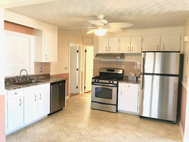 36 Brookside Road Rockland, MA 02370 - Photo 2 of 17 a kitchen with granite countertop a sink stove and refrigerator