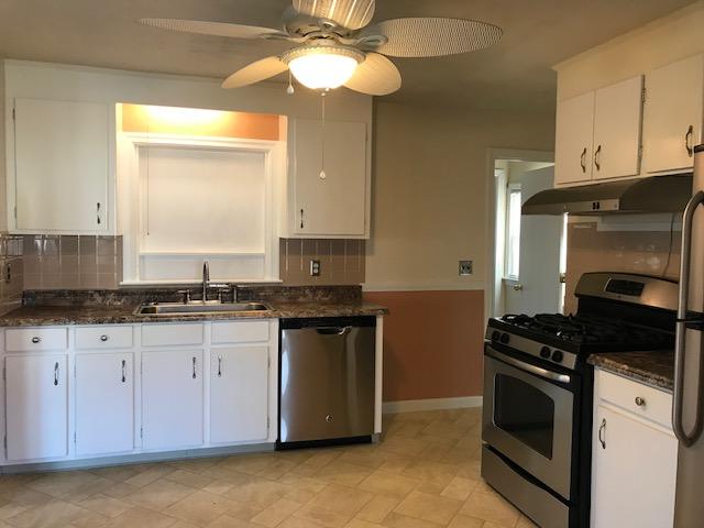 36 Brookside Road Rockland, MA 02370 - Photo 4 of 17 a kitchen with granite countertop stainless steel appliances a stove a sink and a microwave