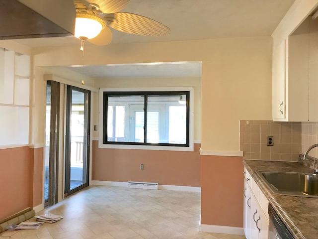 36 Brookside Road Rockland, MA 02370 - Photo 5 of 17 a kitchen with a sink a refrigerator and cabinets