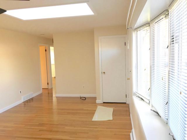 36 Brookside Road Rockland, MA 02370 - Photo 6 of 17 a view of an empty room with wooden floor and a window