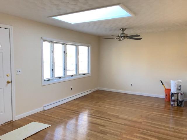 36 Brookside Road Rockland, MA 02370 - Photo 7 of 17 wooden floor in an empty room with a window