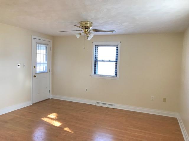 36 Brookside Road Rockland, MA 02370 - Photo 9 of 17 wooden floor in an empty room with a window