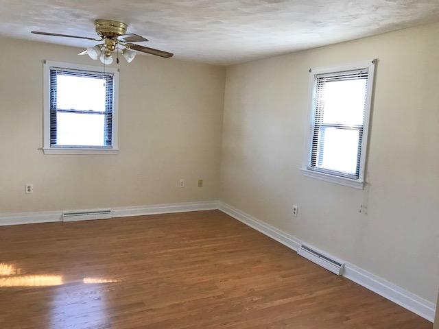 36 Brookside Road Rockland, MA 02370 - Photo 10 of 17 wooden floor in an empty room with a window