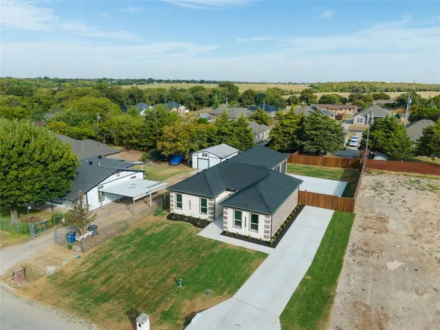 an aerial view of a house with a garden