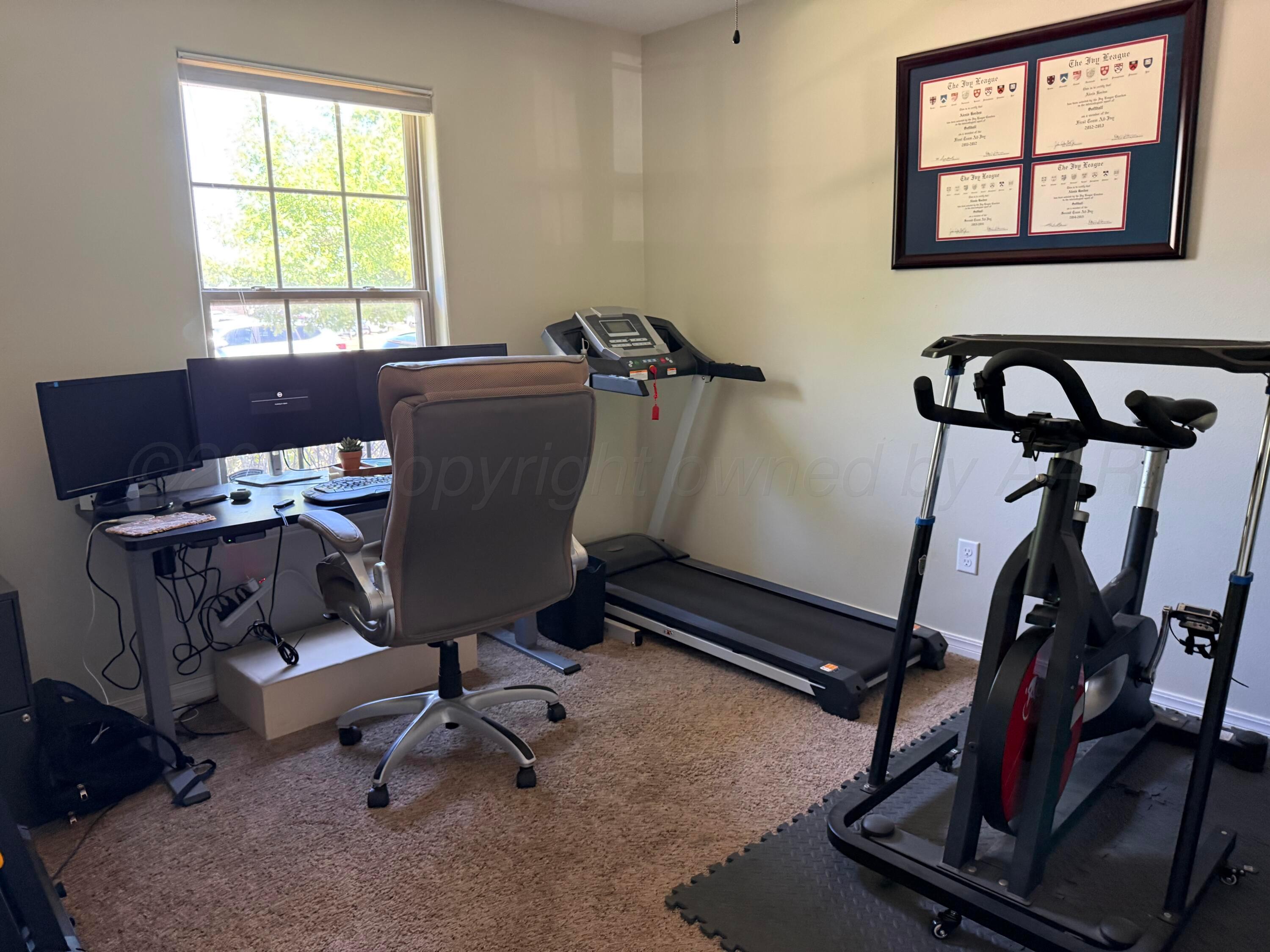9505 Perry Avenue Amarillo, TX 79119 - Photo 16 of 21 a view of a workspace with gym equipment