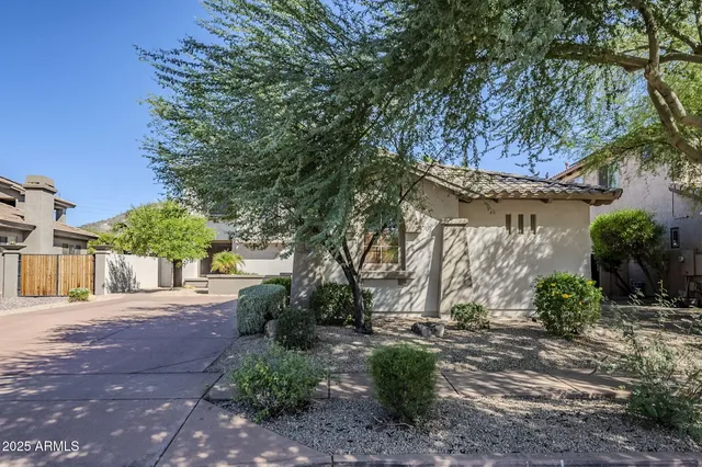 a view of a house with a tree