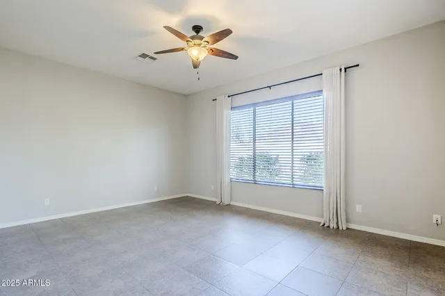 a view of n empty room with a window