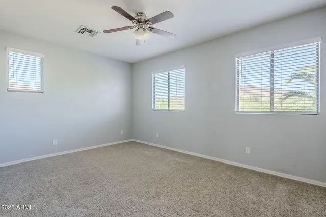 a spacious bathroom with a double vanity sink mirror and double