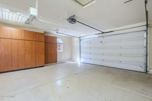 a view of swimming pool with outdoor seating and plants