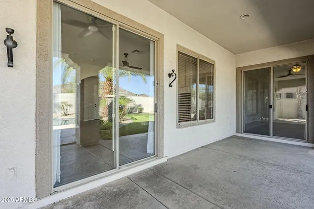 a swimming pool with outdoor seating and plants