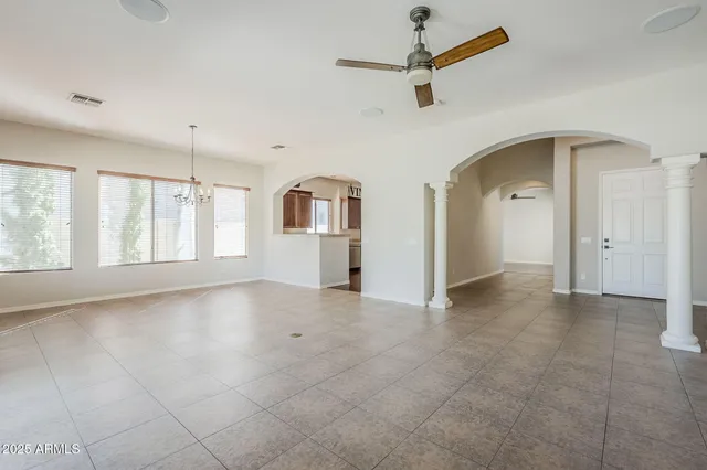 a view of a kitchen with furniture and a ceiling fan