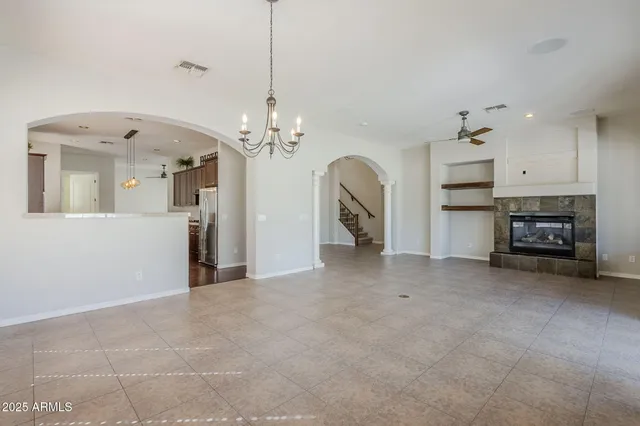 a view of a room with wooden floor and white walls