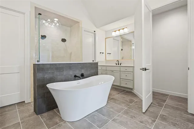 a bathroom with a bathtub and shower