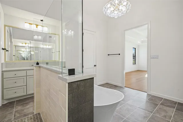a bathroom with a sink a vanity and a mirror