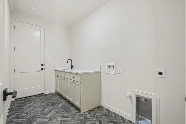 a hallway with a washer and dryer