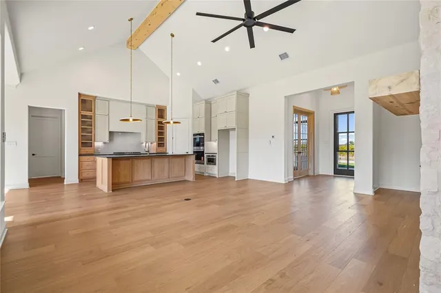 a view of a kitchen with a refrigerator and a sink