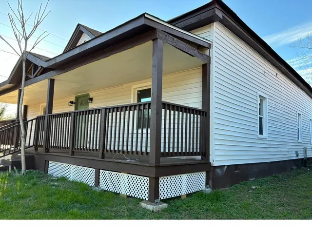 a view of a backyard with a deck