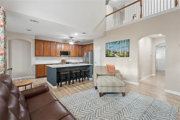 a kitchen with stainless steel appliances granite countertop a sink and a counter space