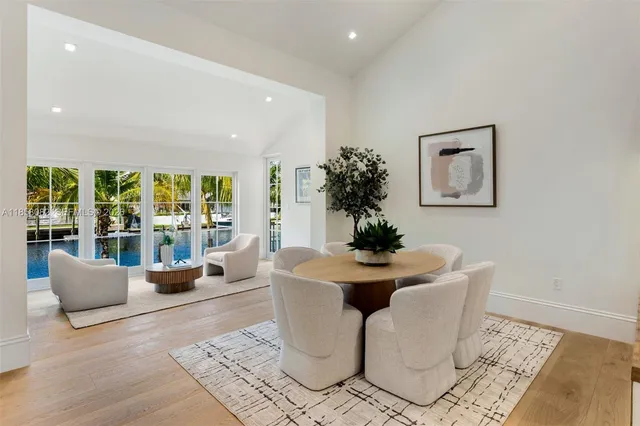 a house with swimming pool next to a yard