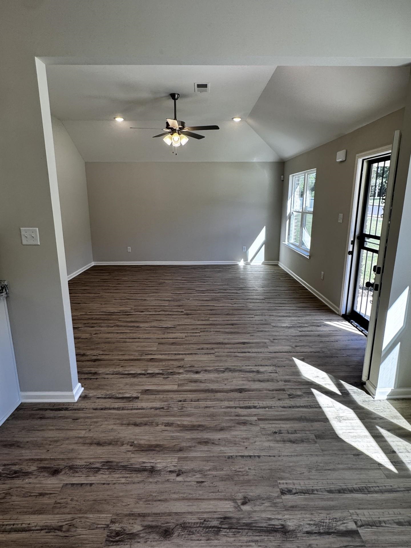 5243 Zodiac Road Memphis, TN 38118 - Photo 3 of 10 Unfurnished living room featuring recessed lighting, lofted ceiling, dark wood-style flooring, and ceiling fan