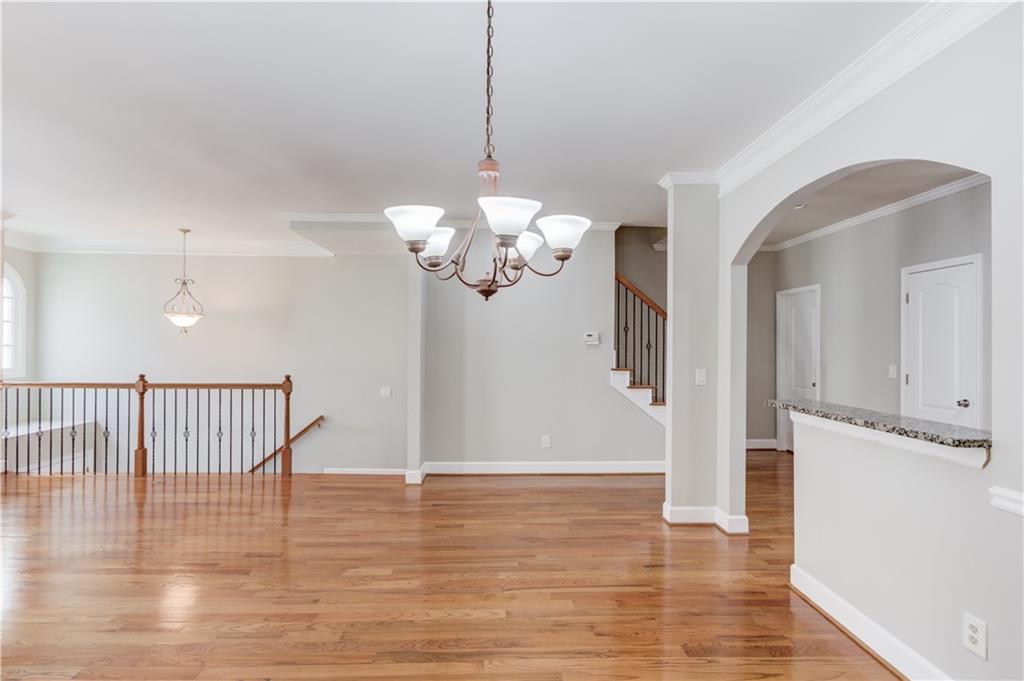 11007 Lorin Way Duluth, GA 30097 - Photo 11 of 30 a view of a chandelier and wooden floor