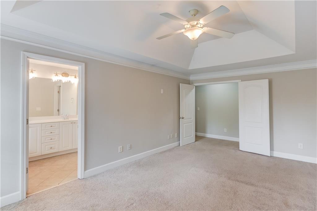11007 Lorin Way Duluth, GA 30097 - Photo 19 of 30 a view of an empty room and a ceiling fan