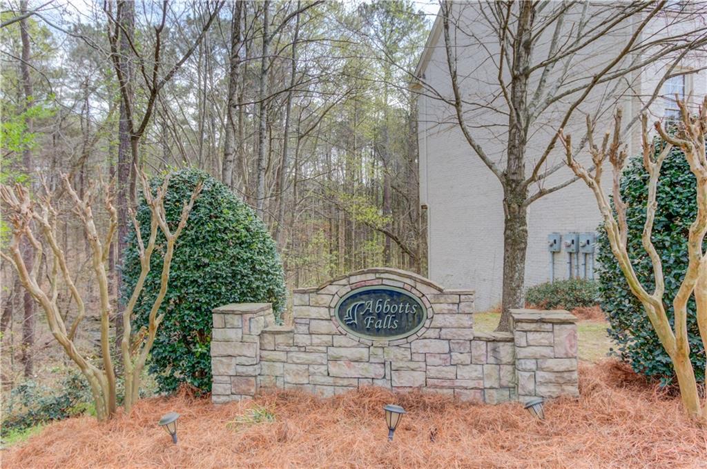 11007 Lorin Way Duluth, GA 30097 - Photo 29 of 30 a backyard of house with trees and outdoor seating
