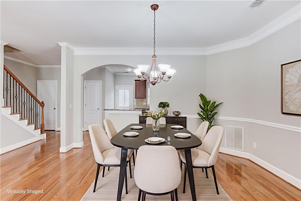 11007 Lorin Way Duluth, GA 30097 - Photo 4 of 30 a view of a dining room with furniture and wooden floor