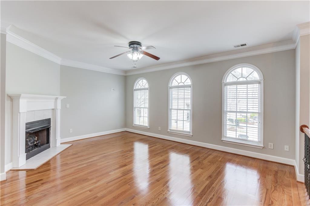 11007 Lorin Way Duluth, GA 30097 - Photo 8 of 30 a view of an empty room with wooden floor and a window