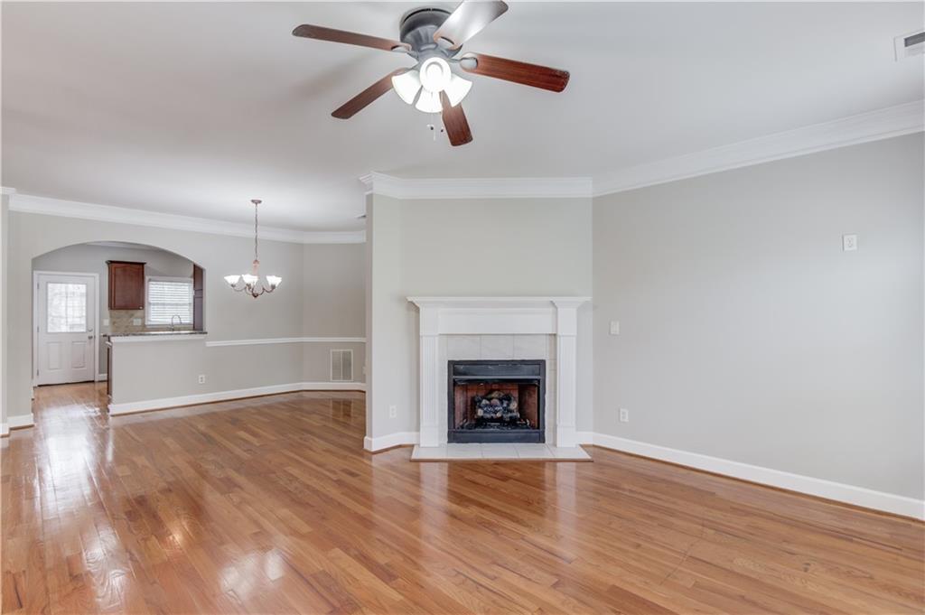11007 Lorin Way Duluth, GA 30097 - Photo 9 of 30 a view of empty room with wooden floor fan and window