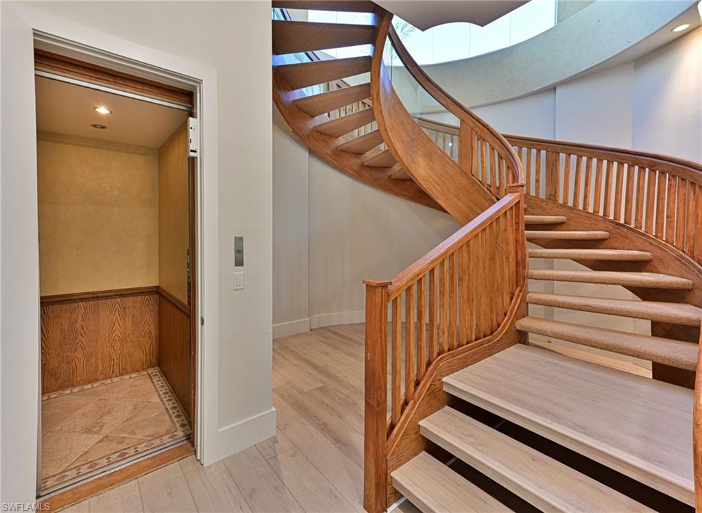 110 St Eustacius Lane Bonita Springs, FL 34134 - Photo 16 of 34 a view of staircase with white walls and railing
