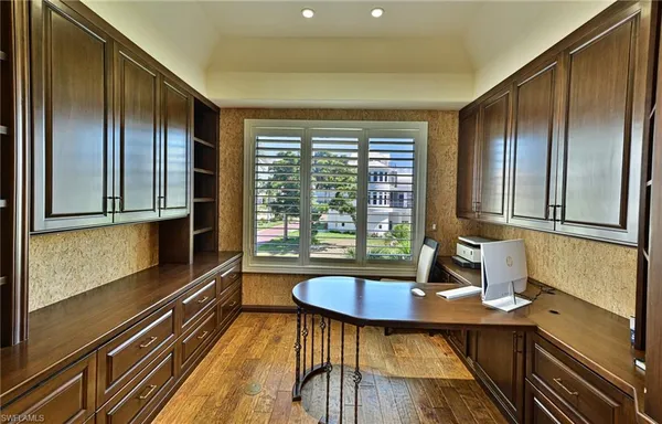a kitchen with sink a refrigerator and windows