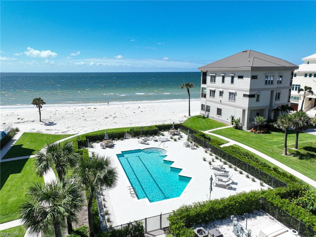 110 St Eustacius Lane Bonita Springs, FL 34134 - Photo 2 of 34 a view of a swimming pool with a yard