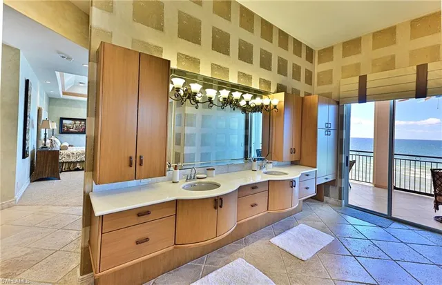 a spacious bathroom with a double vanity sink and a mirror