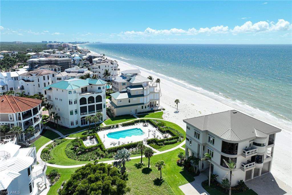 110 St Eustacius Lane Bonita Springs, FL 34134 - Photo 32 of 34 a terrace with outdoor seating and city view