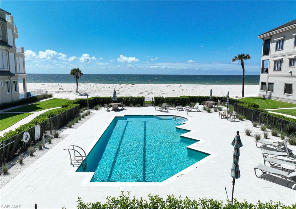 110 St Eustacius Lane Bonita Springs, FL 34134 - Photo 34 of 34 a view of a swimming pool and lounge chairs