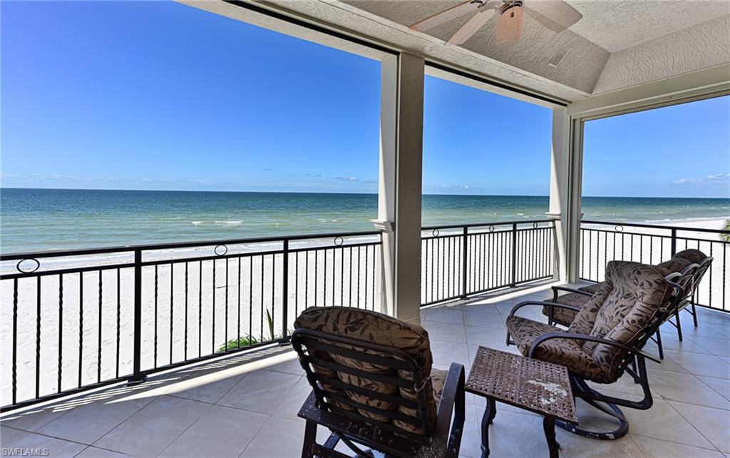 110 St Eustacius Lane Bonita Springs, FL 34134 - Photo 7 of 34 a balcony with table and chairs