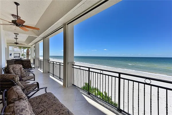 a view of a living room and a balcony