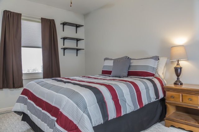 101 Barnes Road Elgin, IL 60124 - Photo 14 of 22 a bedroom with a bed and painting on the wall