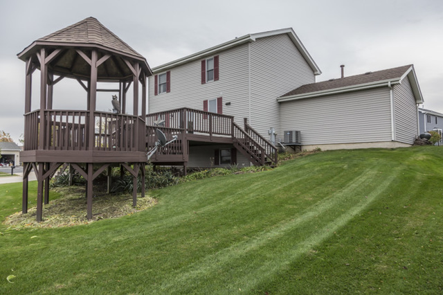 101 Barnes Road Elgin, IL 60124 - Photo 21 of 22 a view of a house with a yard and sitting area