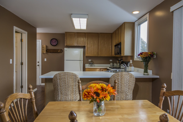 101 Barnes Road Elgin, IL 60124 - Photo 4 of 22 a dining room with furniture and wooden floor