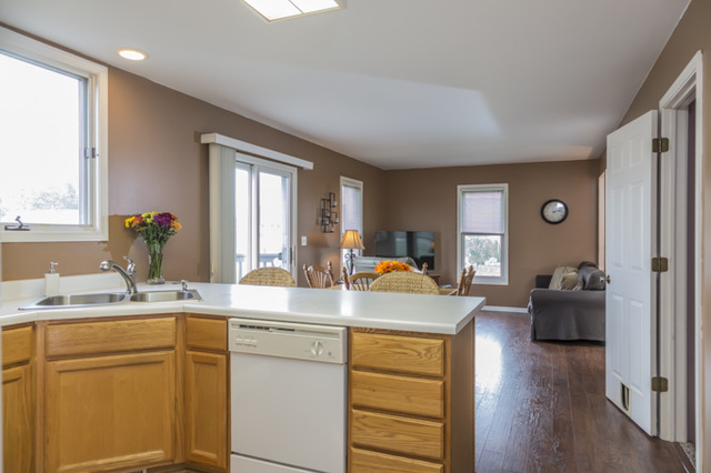 101 Barnes Road Elgin, IL 60124 - Photo 6 of 22 a view of living room with granite countertop furniture and a window