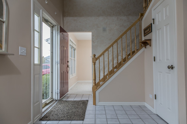101 Barnes Road Elgin, IL 60124 - Photo 9 of 22 a view of an entryway with staircase
