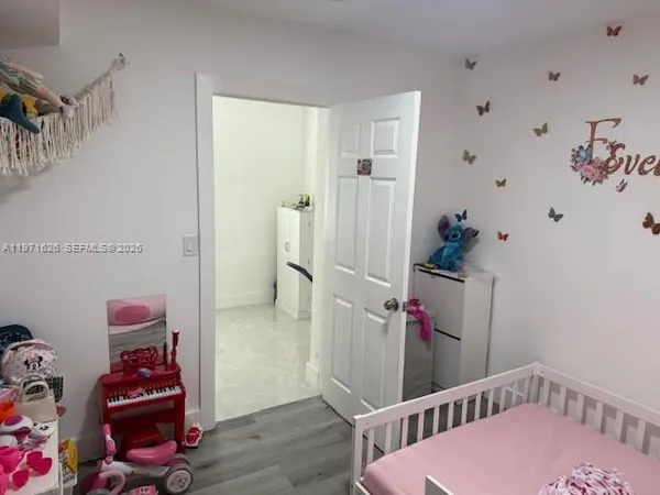 a view of an entryway with wooden floor