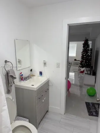 a bathroom with a sink and mirror