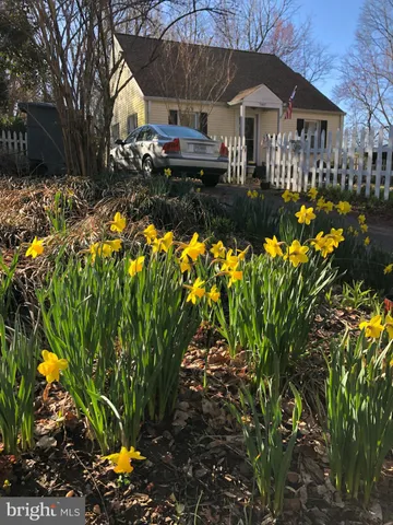 a front view of house with yard and seating area