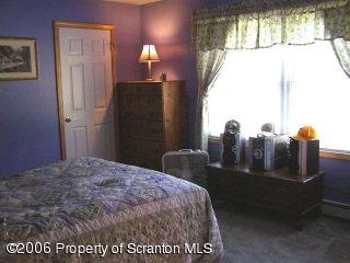 Rr4 Wyalusing, PA 18853 - Photo 4 of 5 a bedroom with a bed and wooden floor