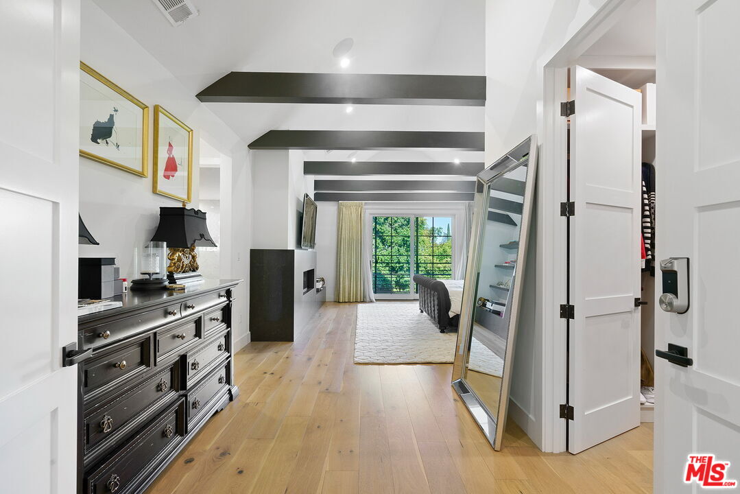 1738 Nichols Canyon Road Los Angeles, CA 90046 - Photo 9 of 25 a kitchen with stainless steel appliances a refrigerator and a stove